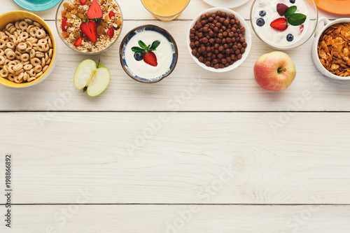 Healthy breakfast meals on wooden table copy space