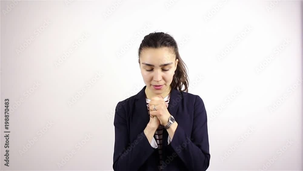 A young beautiful woman prays, asking God for help. A young beautiful woman prays, asking God for help.
