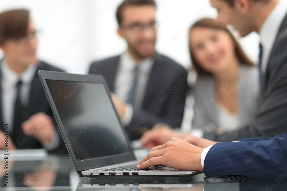 Hands of business man working on laptop.