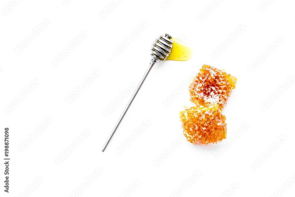Honeycomb filled with honey on plate on white background top view space for text Honeycomb filled with honey on plate on white background top view space for text
