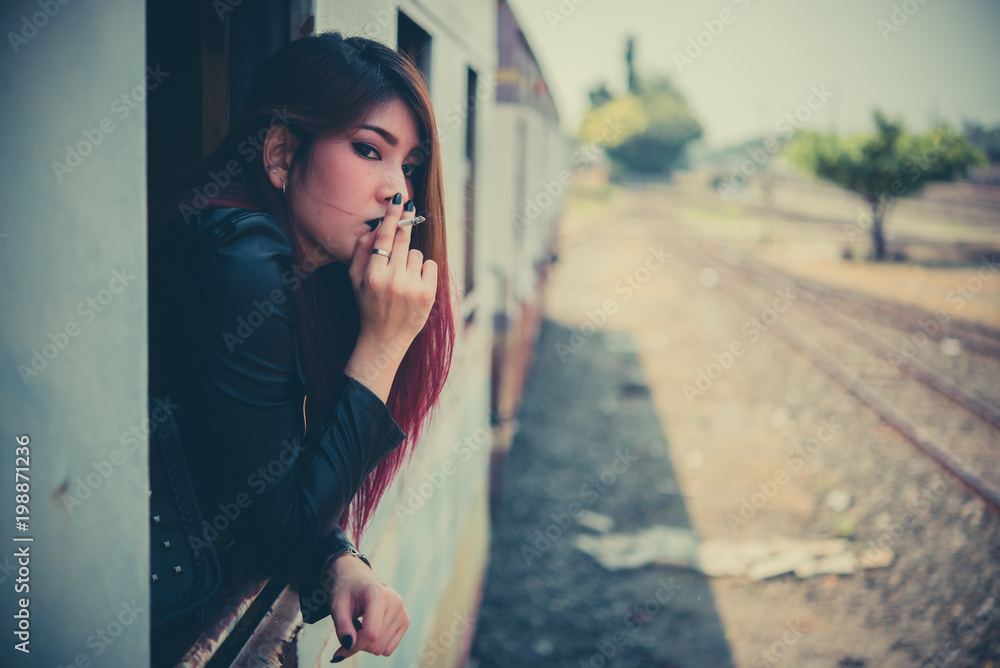 Asian woman sad from love,She smoking because stress from boyfriend,Heartbreak woman concept