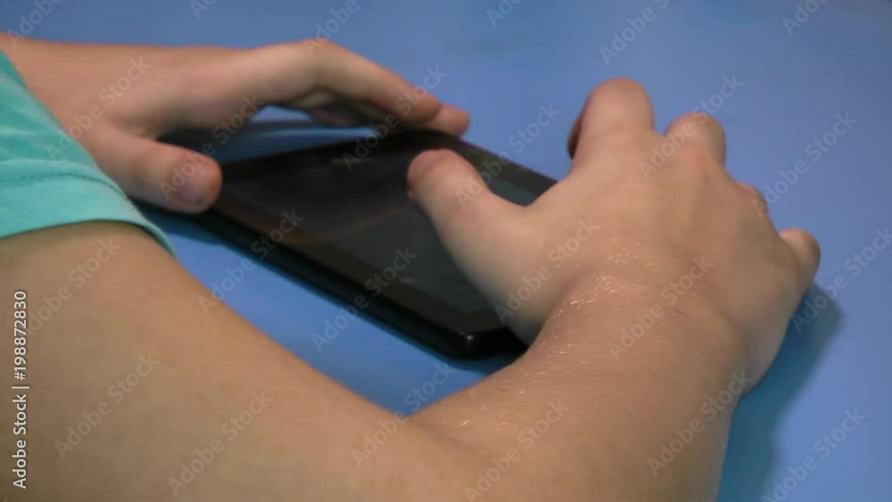 Children finger touching tablet computer touchscreen. Children finger touching tablet computer touchscreen.