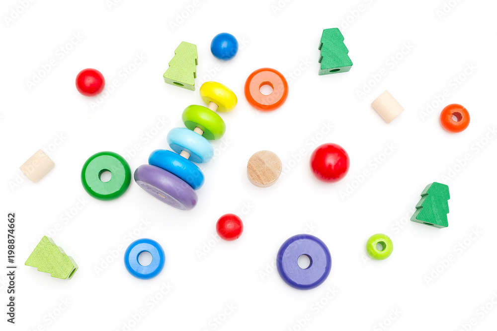 Fototapeta premium Wooden Pyramid and other wooden toys on a white background. Education concept