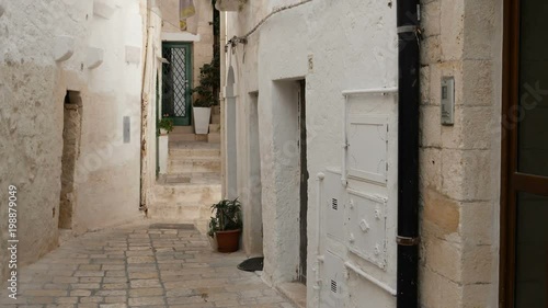 Inside old town of Polignano a Mare, in Puglia region, Italy, along the suggestive narrow streets of the famous italian village by the sea