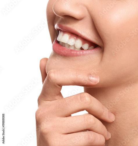 Fototapeta Naklejka Na Ścianę i Meble -  Young woman with beautiful smile on white background, closeup. Teeth whitening
