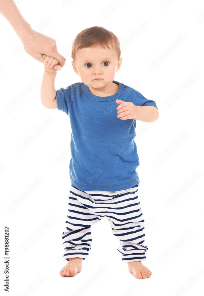 Woman holding her baby's hand on white background. Learning to walk Woman holding her baby's hand on white background. Learning to walk