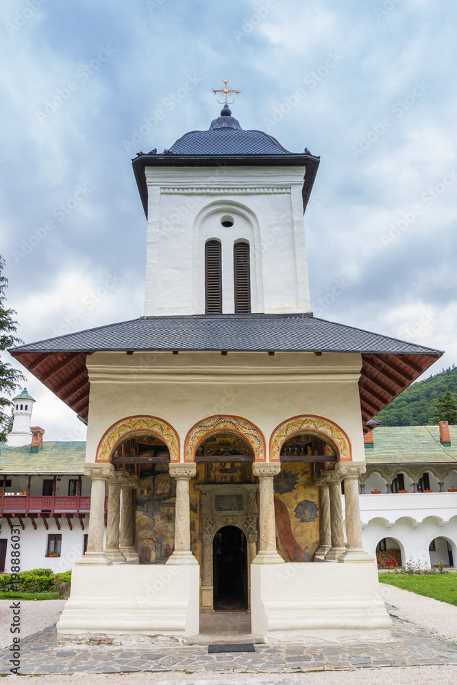 Front of the little white church of the monastery in Sinaia, Romania