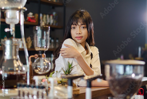 Girl barista bartender waiter in uniform