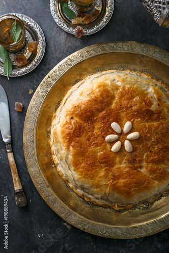 Top view of bastilla, layered moroccan pie with chicken