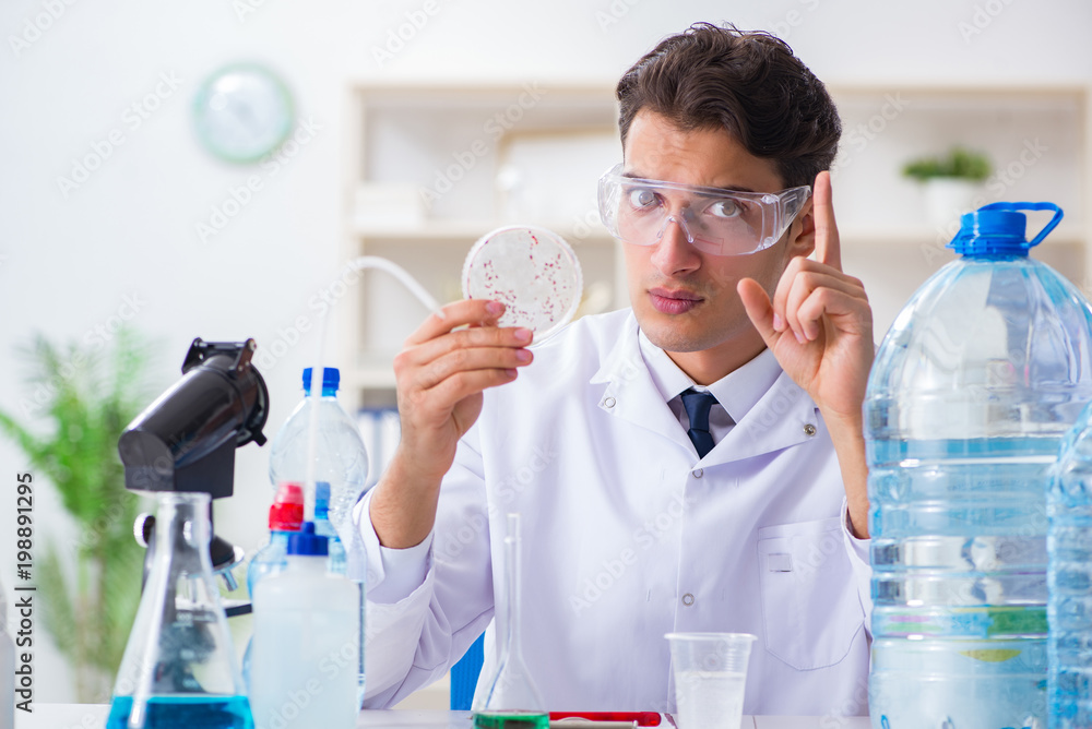 Lab assistant testing water quality Lab assistant testing water quality