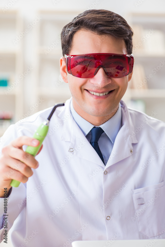 Naklejka premium Young dentist working in the dentistry hospital