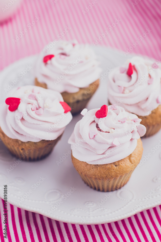 Muffins with pink cream