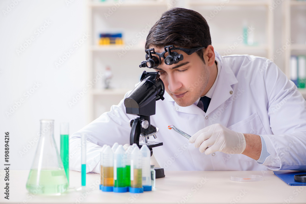 Young chemical scientist working in lab Young chemical scientist working in lab