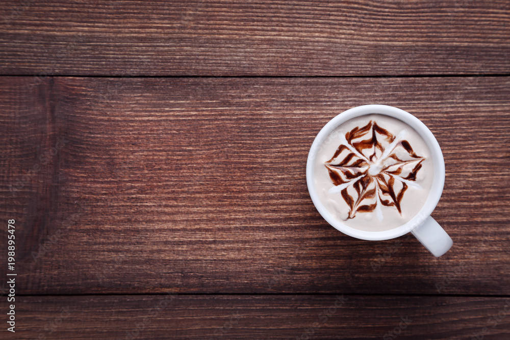 Cup of coffee on brown wooden table Cup of coffee on brown wooden table