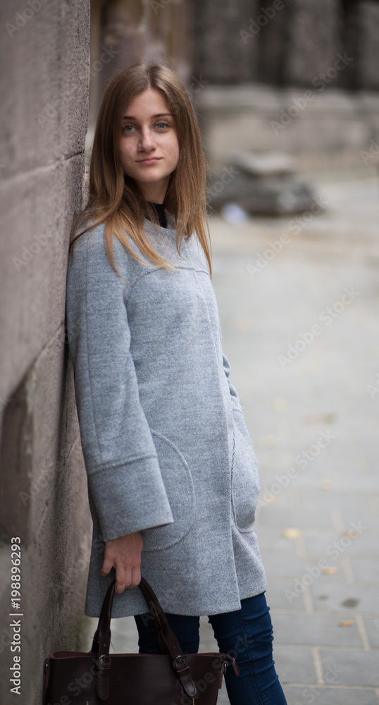 Portrait young businesswomen in gray