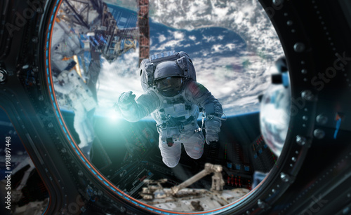 Fototapeta Naklejka Na Ścianę i Meble -  Astronaut working on a space station 3D rendering elements of this image furnished by NASA