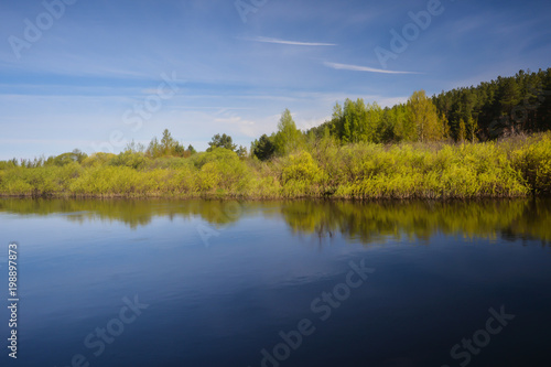 Spring on the forest river. © sergunt