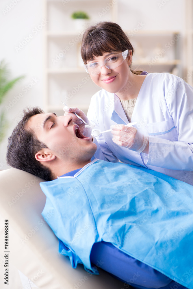 Patient visiting dentist for regular check-up and filling Patient visiting dentist for regular check-up and filling