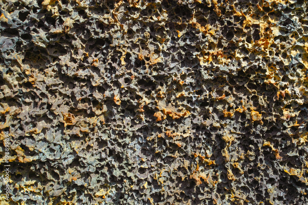 Abstract dark background, natural lava stone texture close up Abstract dark background, natural lava stone texture close up