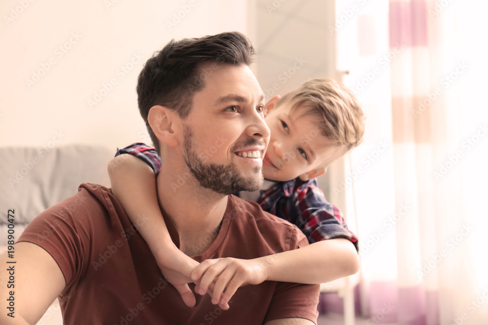 Little boy and his dad spending time together at home Little boy and his dad spending time together at home
