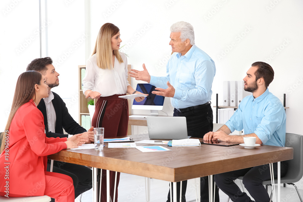Office employees having argument during business meeting Office employees having argument during business meeting