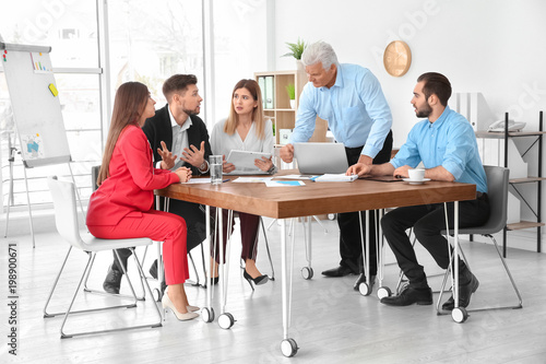 Office employees having argument during business meeting