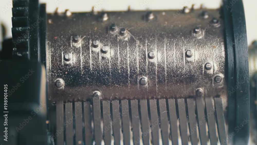 The music box mechanism rotates closeup. Detailed view of the insides