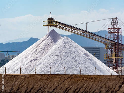 White pyramids with natural sea salt, salt works on factory near Eilat in Israel