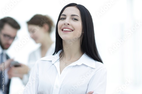 close-up of a beautiful woman manager and co-workers in the office