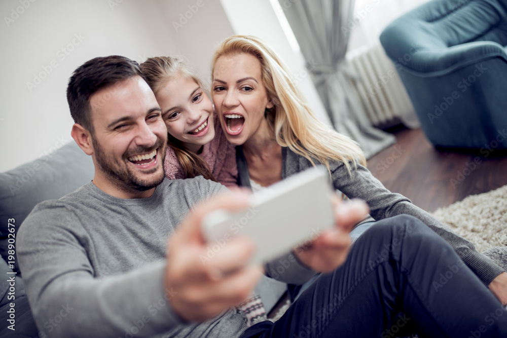 Happy family taking selfie in their house Happy family taking selfie in their house