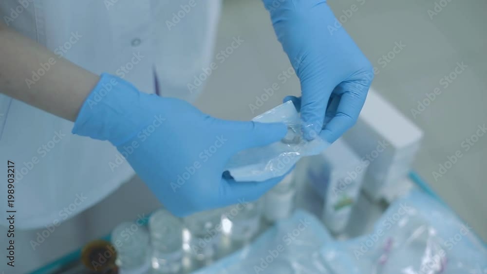 dentist in his office prepares expander for mouth dentist in his office prepares expander for mouth