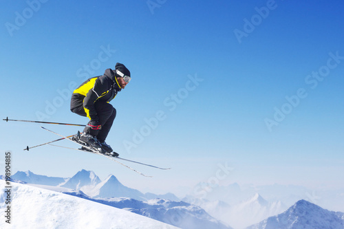 Jumping skier at mountains © destillat