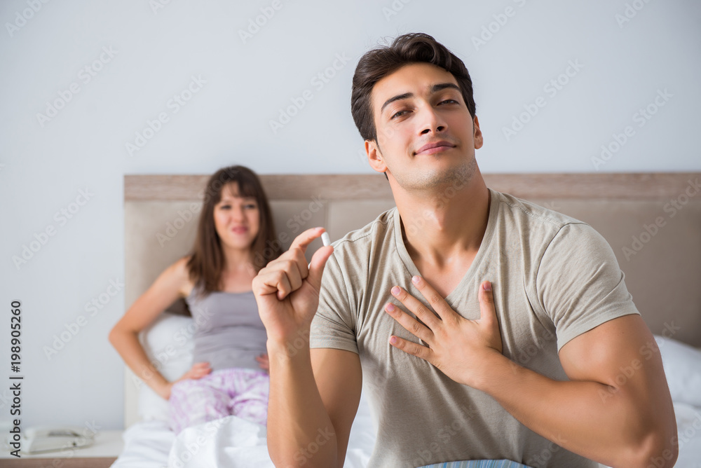 Man suffering from impotency with pill Man suffering from impotency with pill