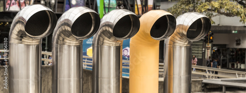 Five shiny stainless steel ventilation pipes atop the Pre-Columbian Gold Museum in San Jose, Costa Rica.