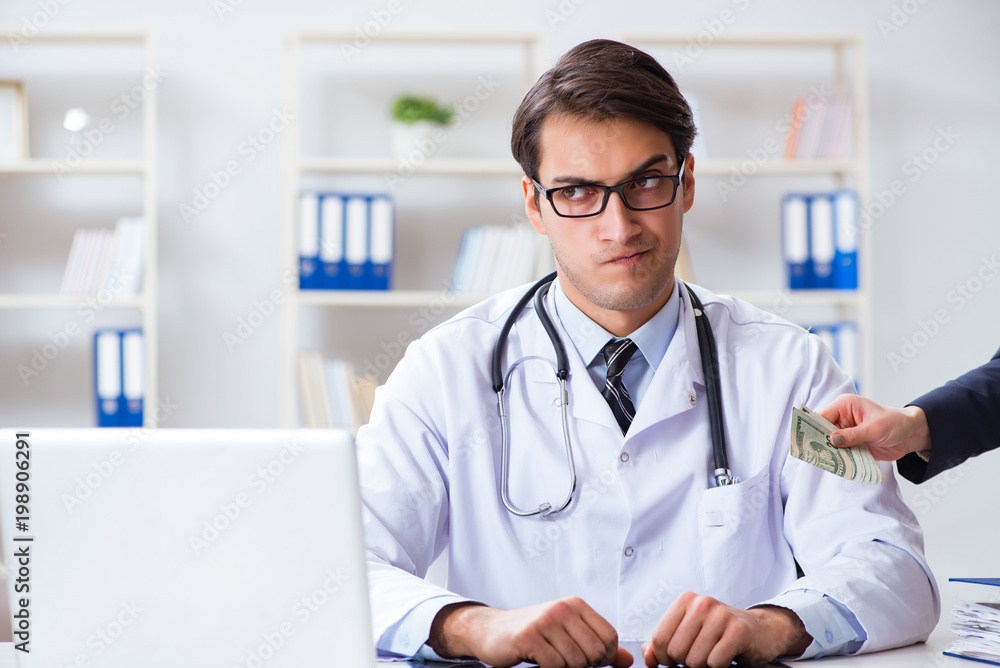 Doctor in corruption concept with being offered bribe Doctor in corruption concept with being offered bribe