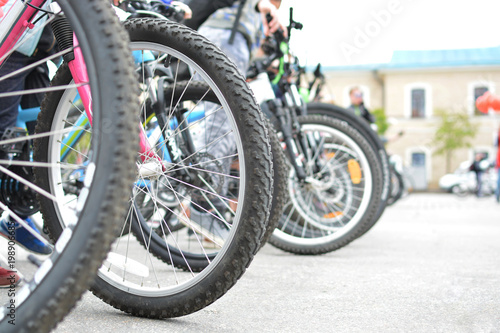 Bicycle wheels. A group of cyclists. Bicycle tour