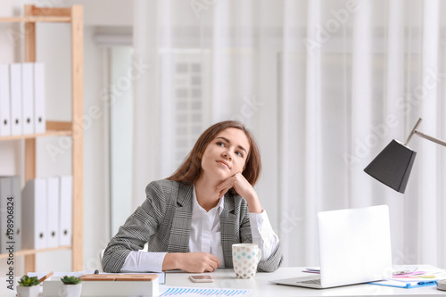 Young woman resting on work...