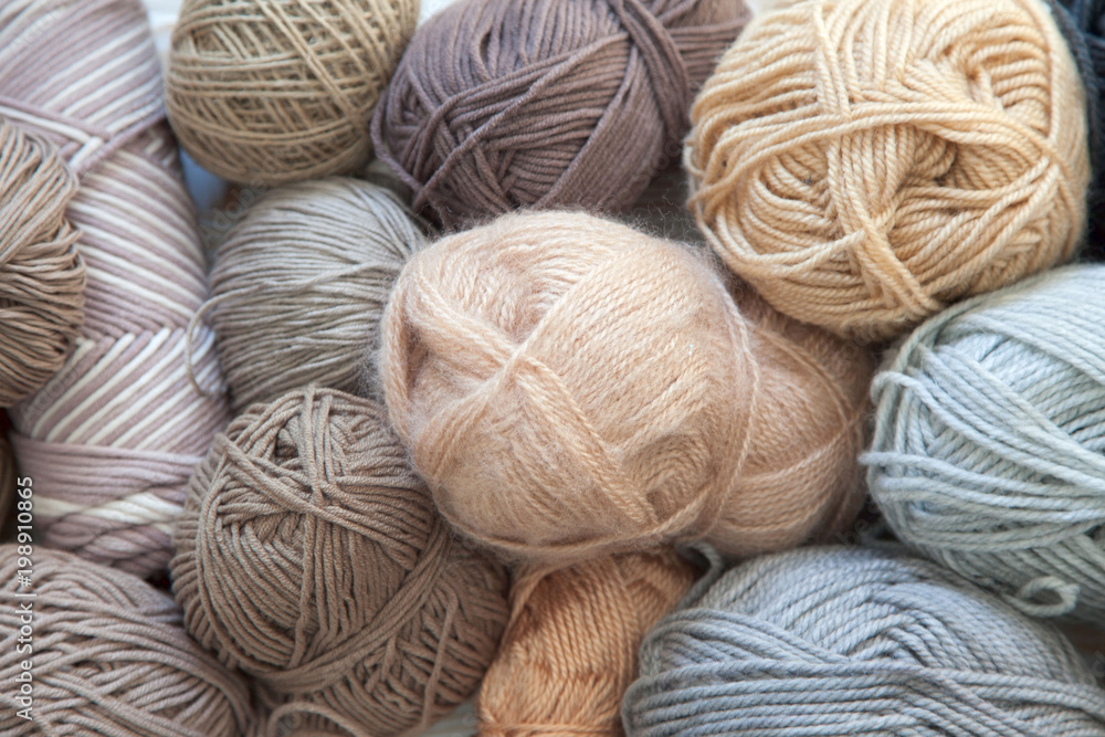 Wool and cotton yarn for knitting of neutral natural color. Background is  aged white wood. Stock Photo | Adobe Stock