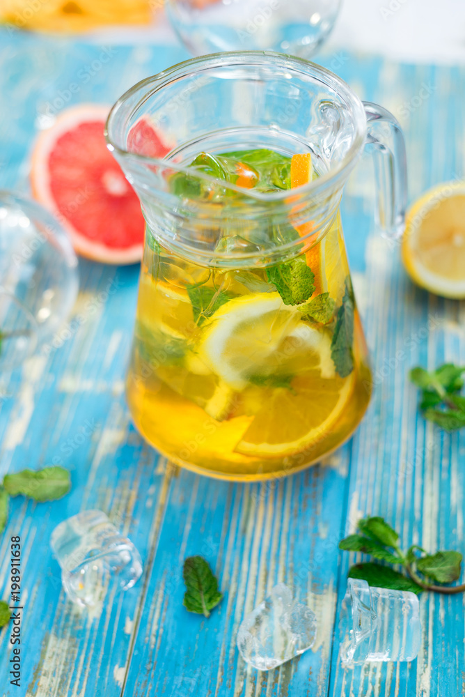 carafe with lemon drink, fruit and mint carafe with lemon drink, fruit and mint