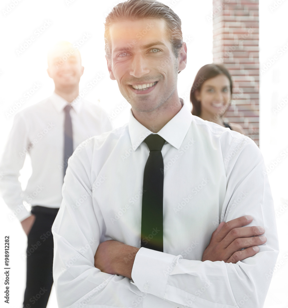 portrait of a successful business person on the background of colleagues. portrait of a successful business person on the background of colleagues.
