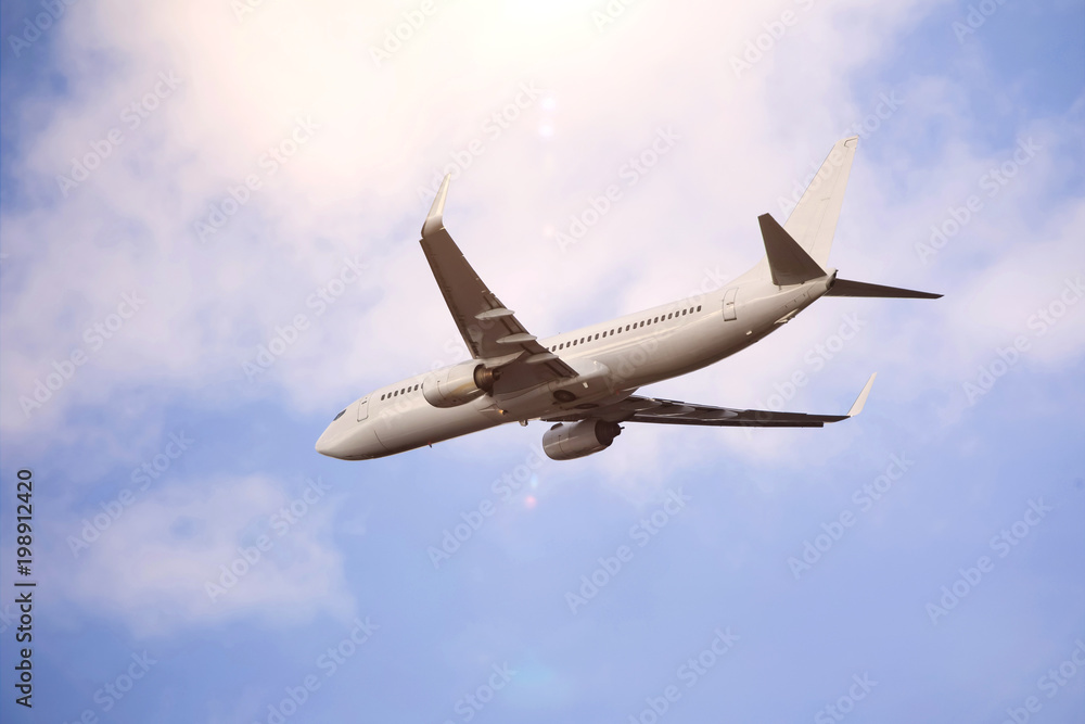 plain passenger airplane starting in a cloudscape plain passenger airplane starting in a cloudscape