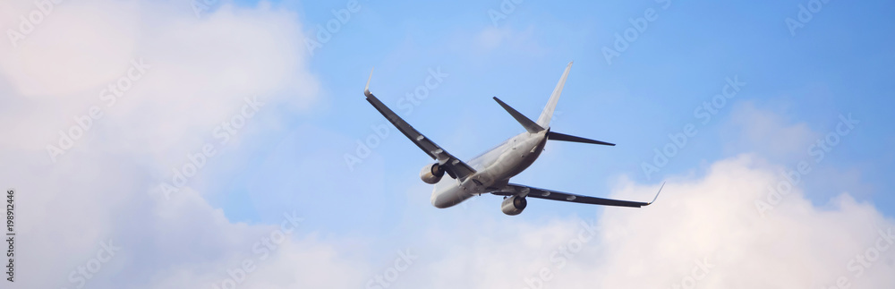 plain passenger airplane starting in a cloudscape plain passenger airplane starting in a cloudscape