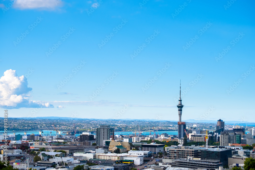 Landscape of Auckland City, New Zealand with the sea, tower, blue sky and cloud.  View from Mt. Eden