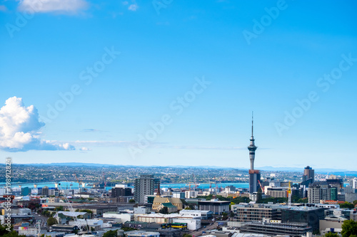 Landscape of Auckland City, New Zealand with the sea, tower, blue sky and cloud. View from Mt. Eden