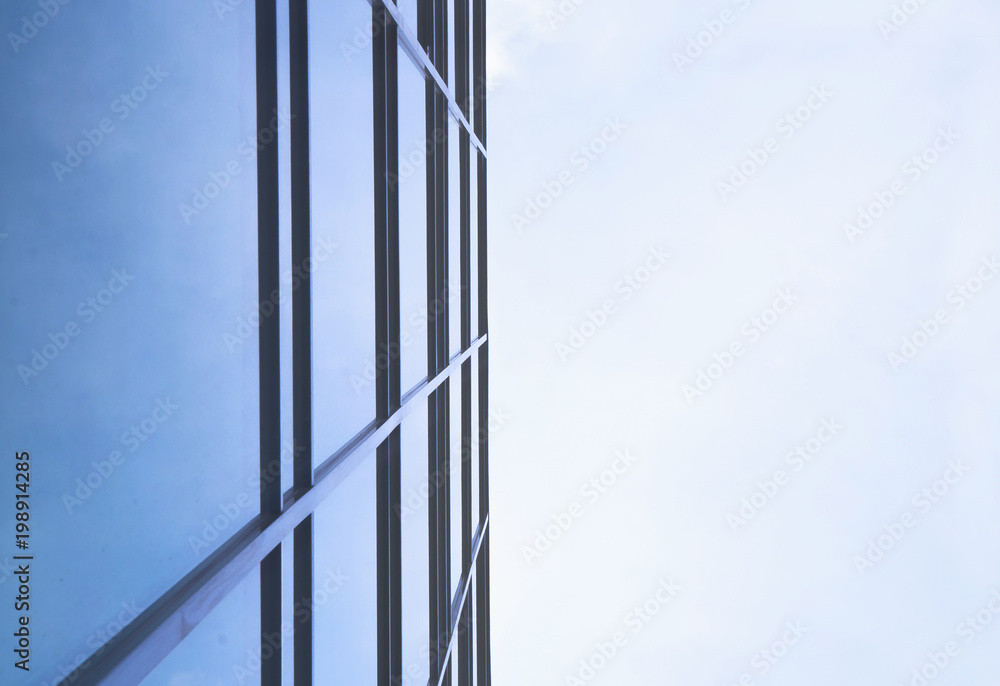 Panoramic and perspective angle view to steel blue background of glass high rise building skyscrapers in modern futuristic downtown Panoramic and perspective angle view to steel blue background of glass high rise building skyscrapers in modern futuristic downtown