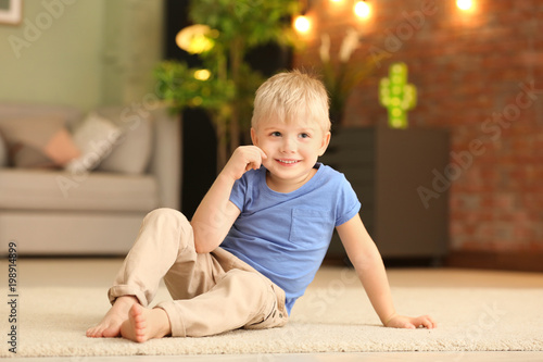 Cute little boy sitting on ...