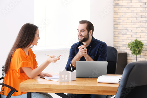 Real estate agent with clie...