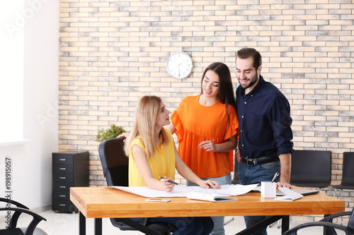 Real estate agent with clie...