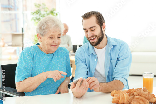 Young caregiver teaching se...