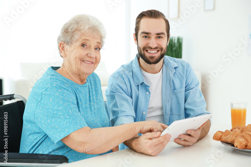 Young caregiver teaching se...